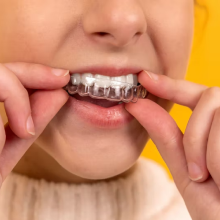 Girl adding braces on her teeth