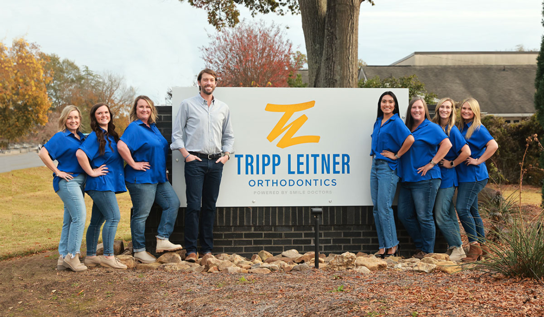 Dr. Tripp Leitner and Team take picture in front of orthodontic office in Rock Hill, SC